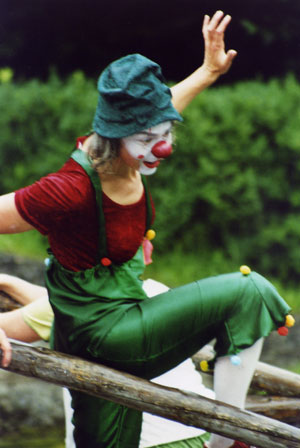 Playfoolspirit Clowning - Ursula leaping over wooden rail.